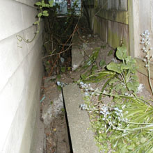 Crumbling lip of the retaining wall